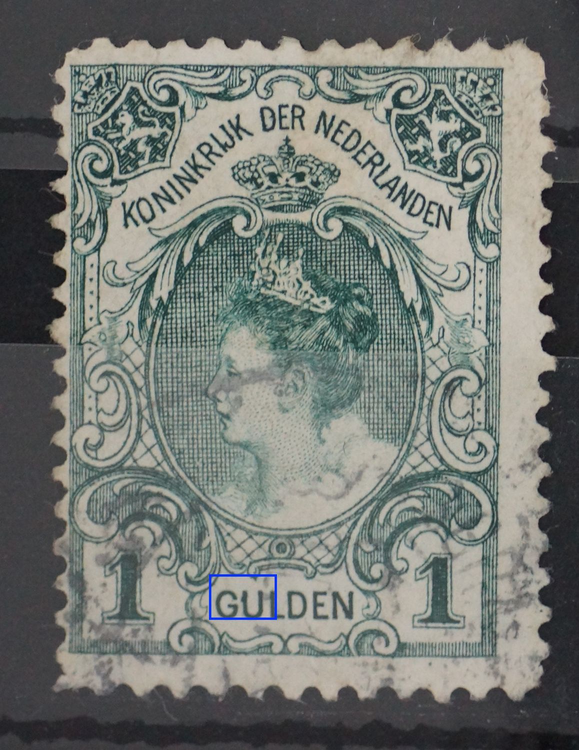 NVPH 77 - groene vlek aan de U van GULDEN