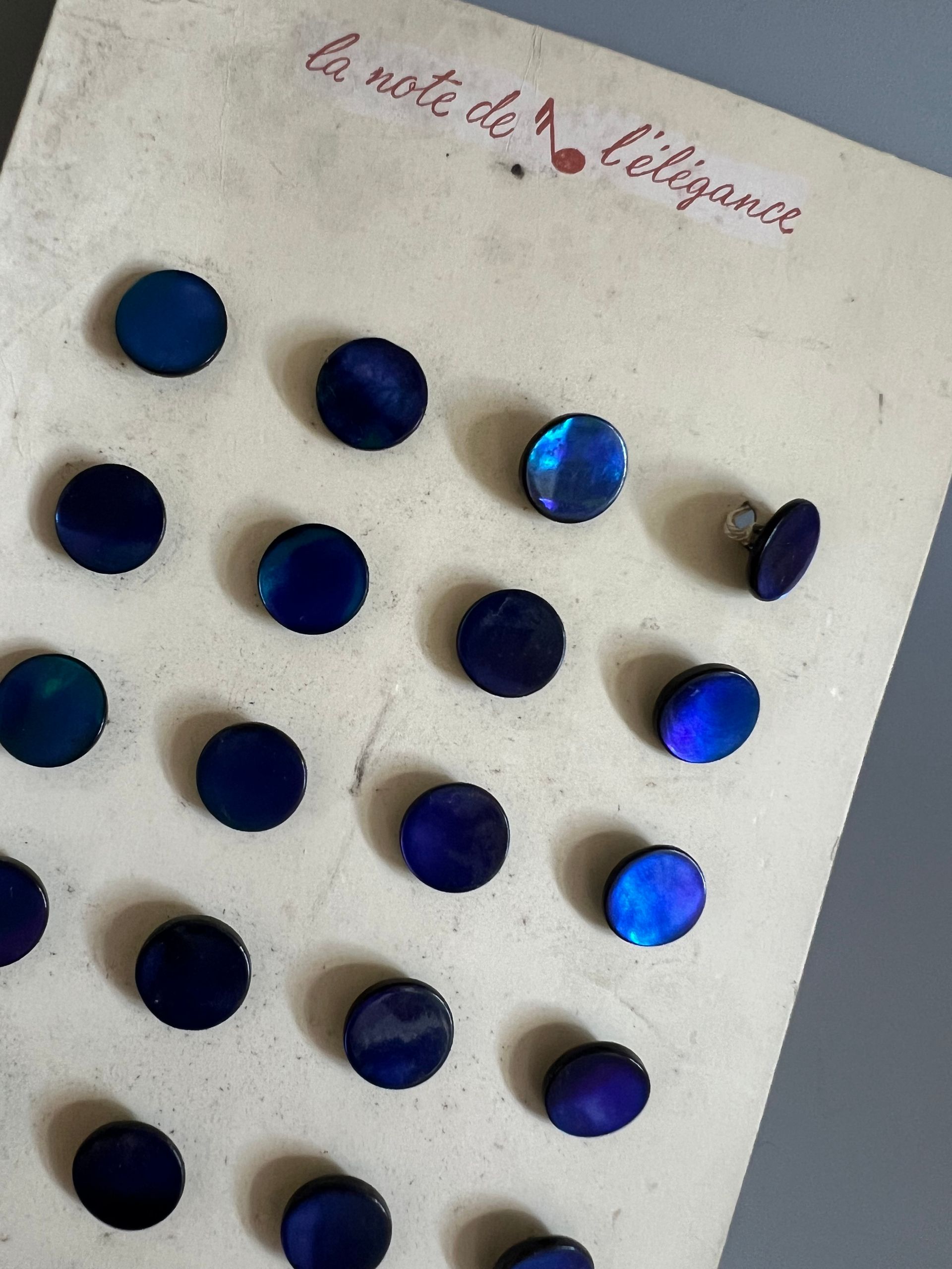 Early 20thc 24 x Dyed Blue/Purple Mother of Pearl Buttons on Original Card