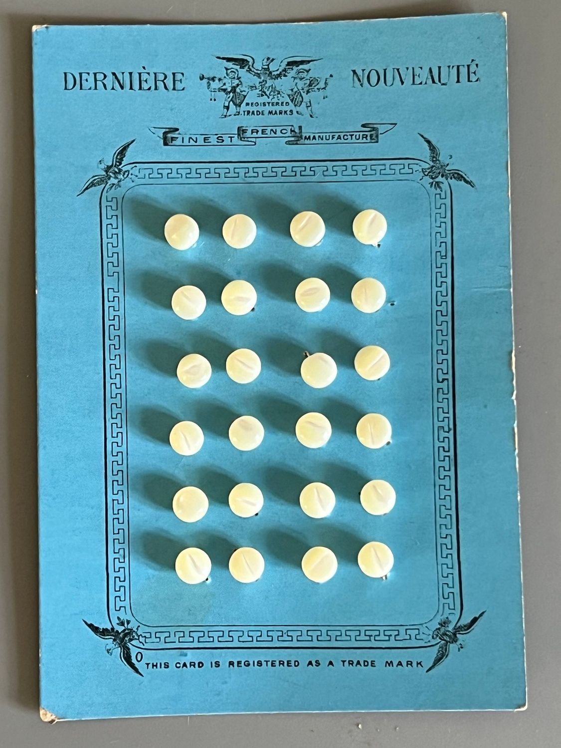 Early 20thc 24 x French Mother of Pearl Tiny Buttons on Original Card