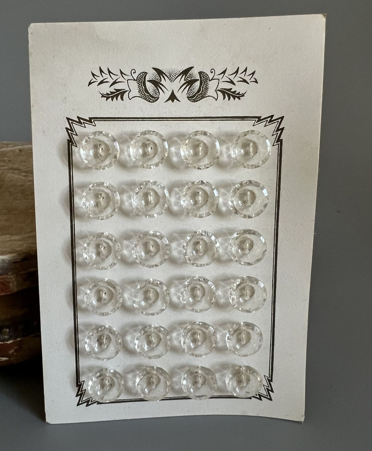 Early 20thc 24 x  Clear Glass Buttons on Original Card