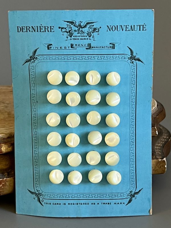 Early 20thc 24 x French Small Round Mother of Pearl Buttons on Original Card
