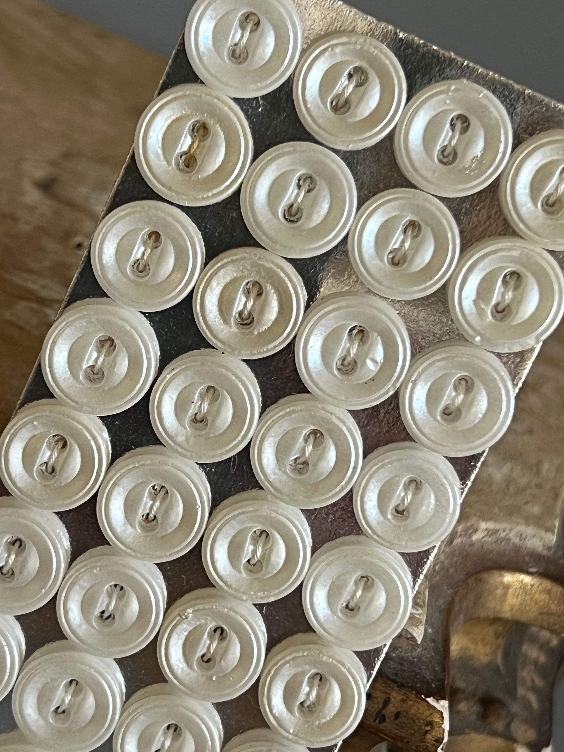 Early 20thc 24 x Small Round Glass Pearlised Buttons on Original Card