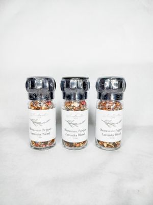 Three culinary lavender and black pepper seasoning in glass grinder jars