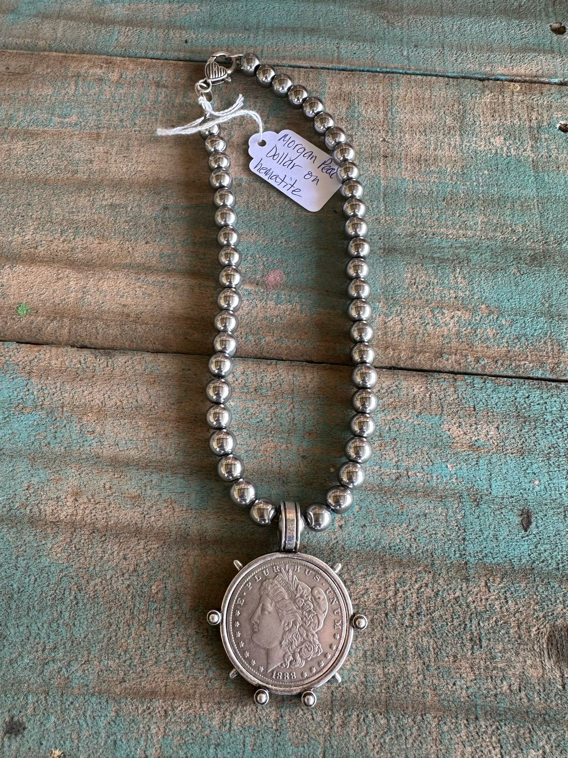 Morgan Peace Dollar On Hematite