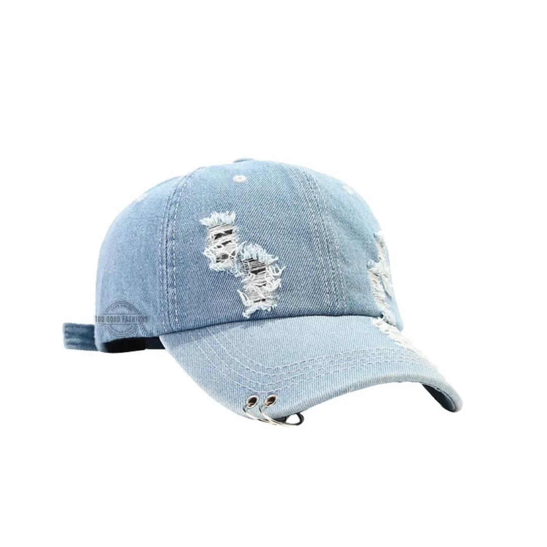 Light wash distressed denim cap with metal double ring design, streetwear look

