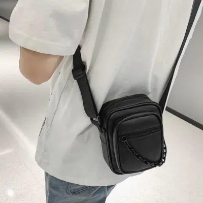 Black Crossbody Bag with Chain Accessory