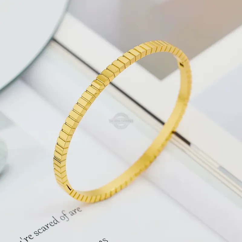 Gold stainless steel bangle with stacked cube design