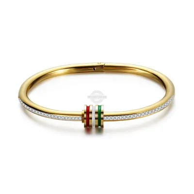 Gold stainless steel screw bangle with inlaid gems