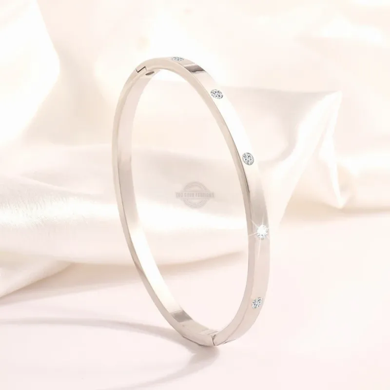 Silver stainless steel bangle with delicate inlaid gems