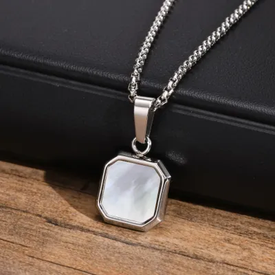 Silver square pendant necklace with pearl accent, elegant and timeless design	