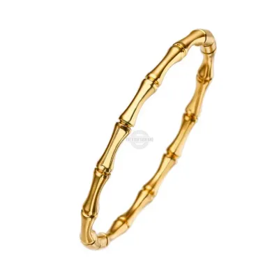 Gold bangle with bamboo-inspired pattern