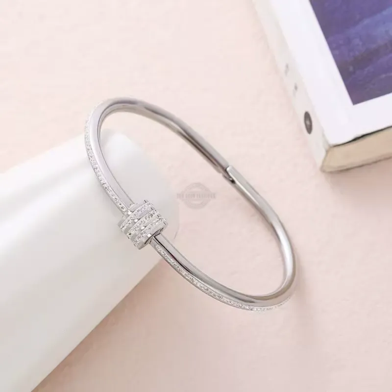 Silver stainless steel screw bangle with inlaid gems