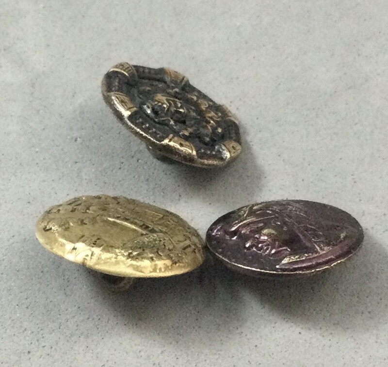 Three Small Brass Picture Buttons including Jester