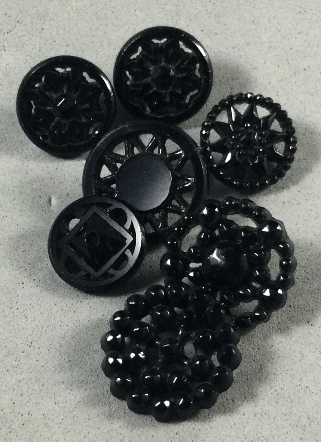 Group of Seven Small Openwork Black Glass