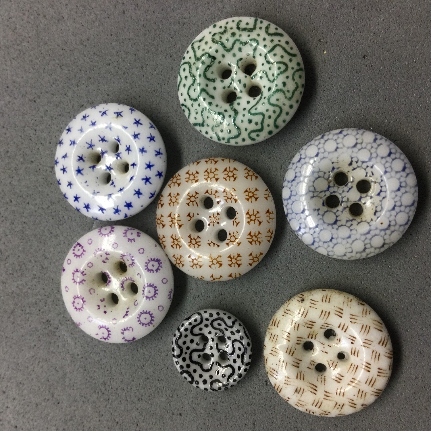 Seven China Calico Buttons