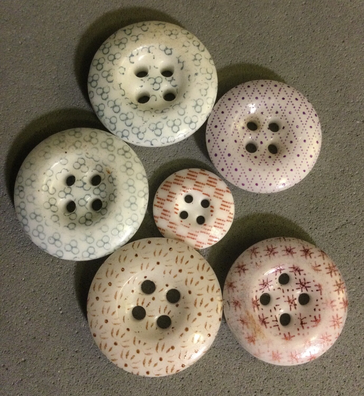 Six Calico China Buttons