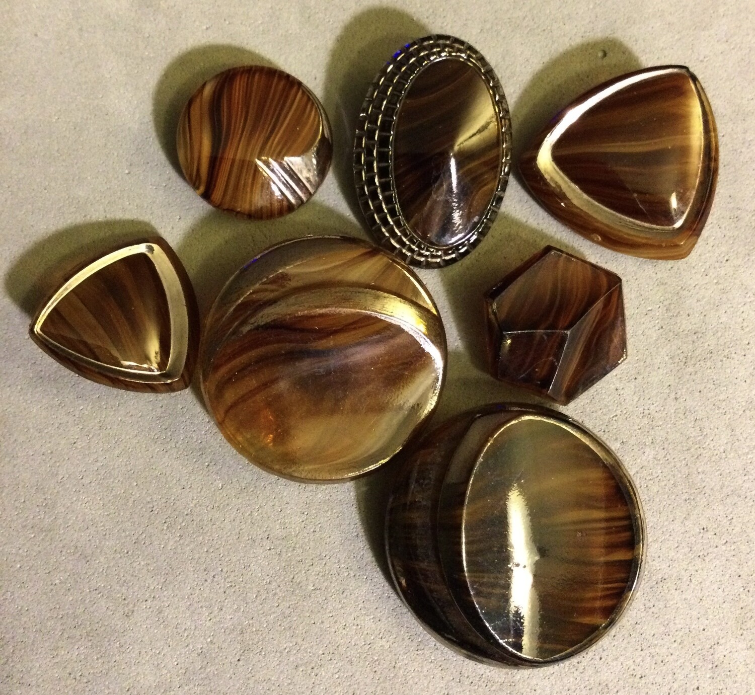 Seven Art Deco Mottled Brown Glass Buttons