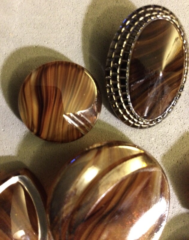 Seven Art Deco Mottled Brown Glass Buttons
