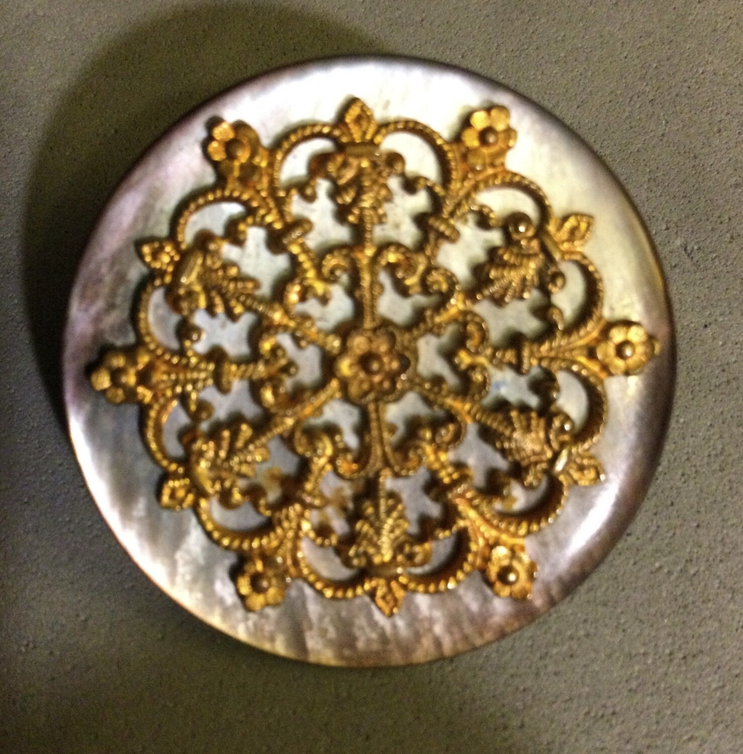 Smokey pearl topped with openwork gilt brass