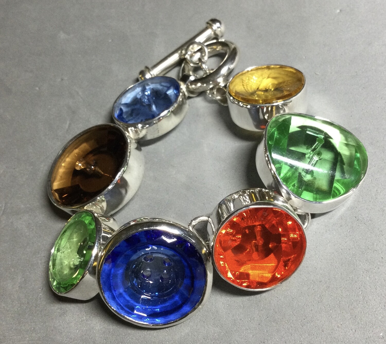 COLORFUL GLASS BUTTONS SET IN STERLING BRACELET