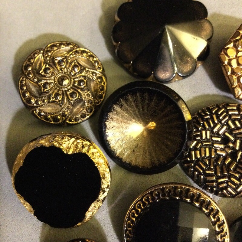 Group of Eleven Black Glass with Gold Luster
