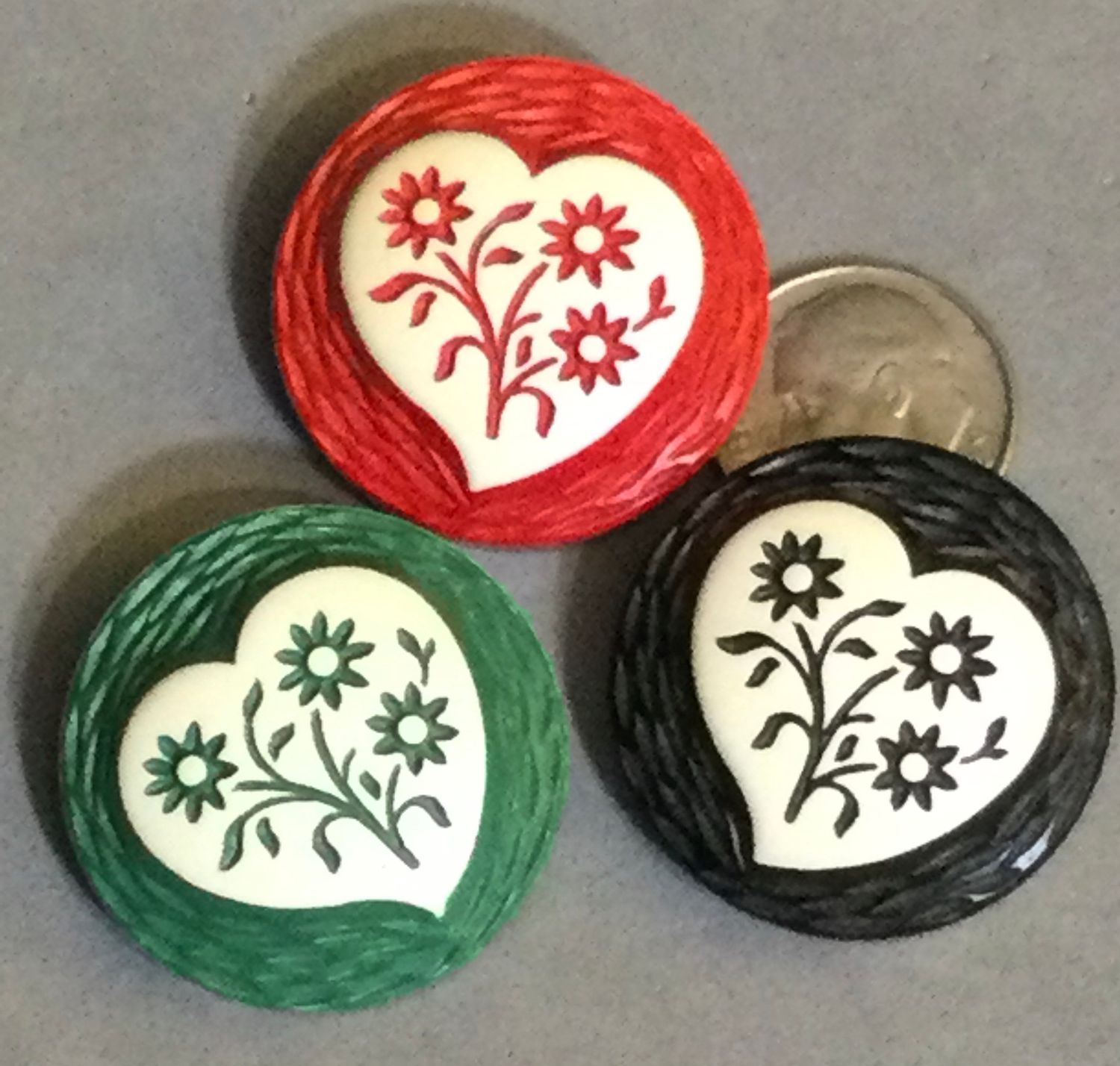 Three Buff Celluloid Hearts and Flowers