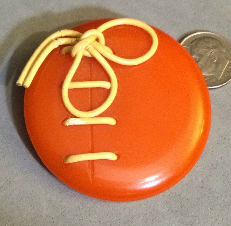 “Laced” Orange Bakelite. TWO INCHES