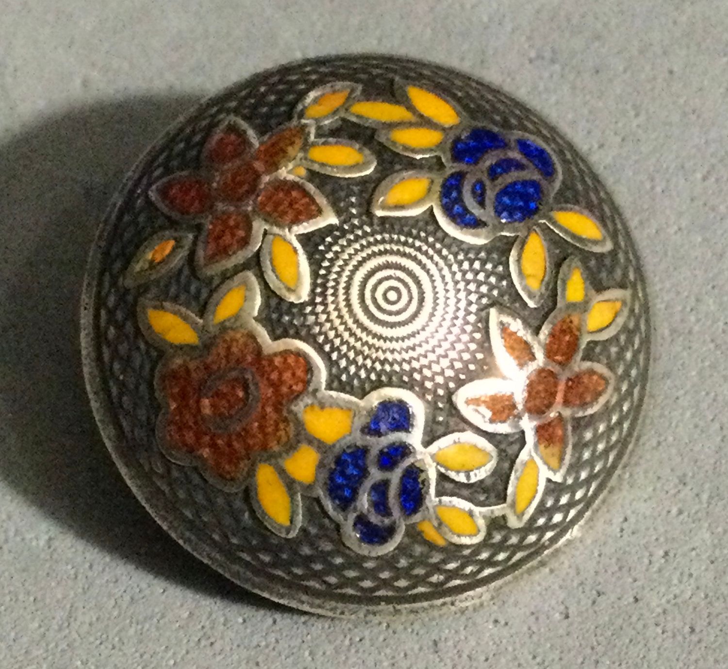 SILVERED BRASS WITH APPLIED ENAMELED FLOWERS AND LEAVES