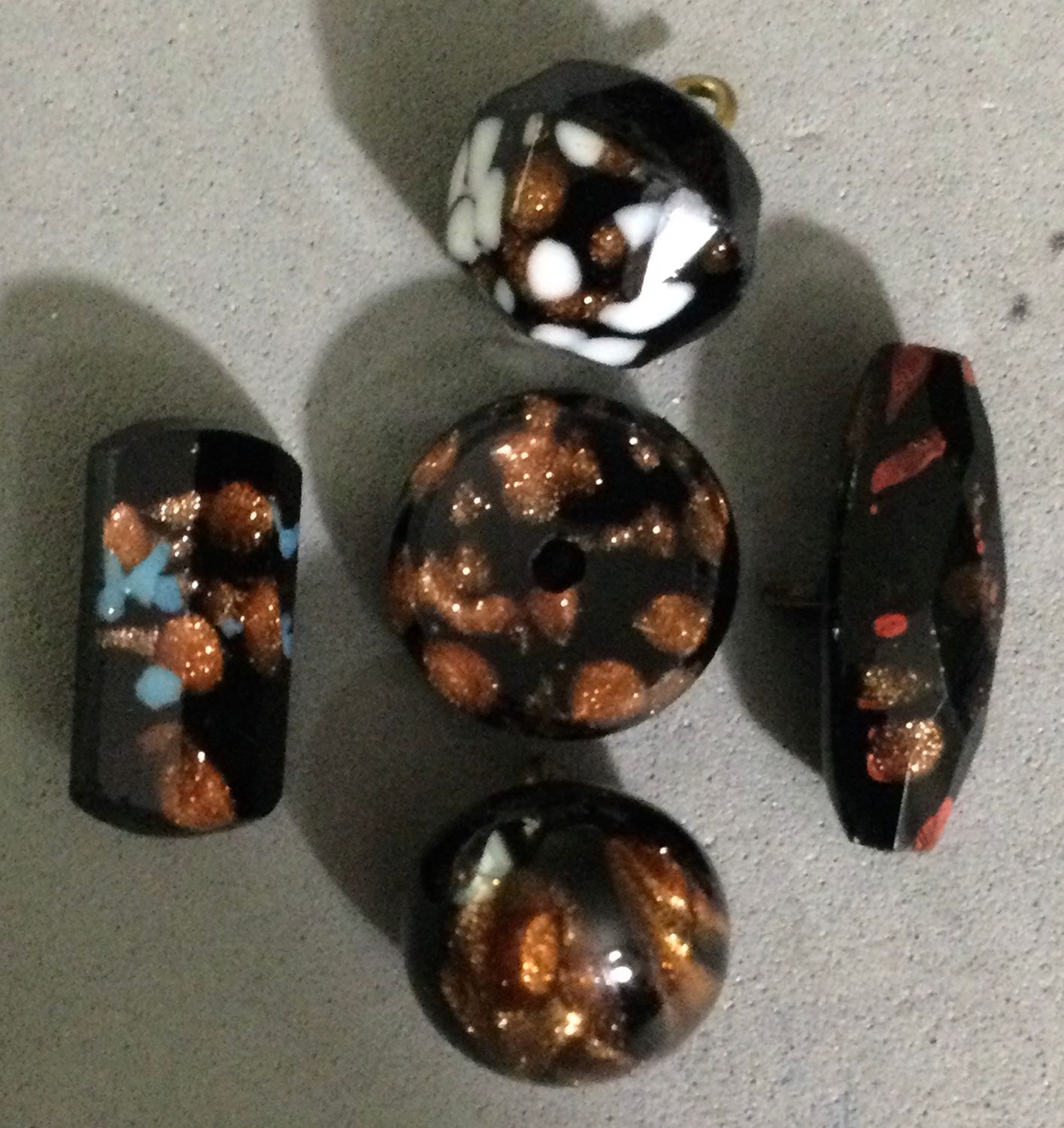 Group of Five Black Glass with Goldstone and Color