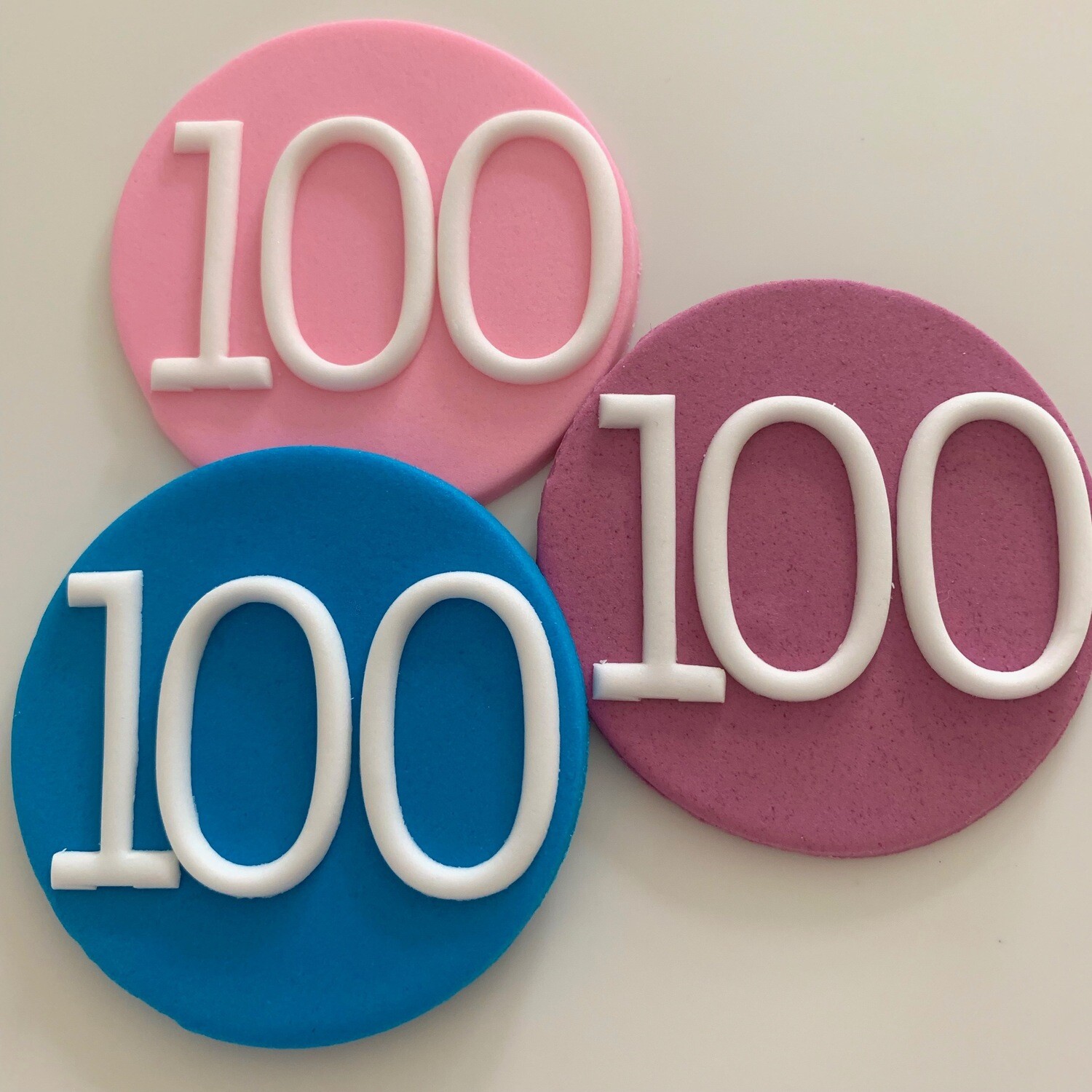Number Plaque. One small round sugar paste plaque with white number in a colour of your choice for adding to any of our products. Suitable for birthday, anniversary and special milestone cakes.