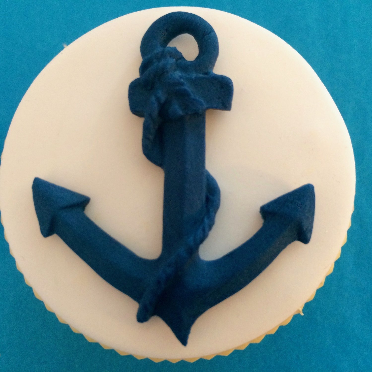 One anchor illustrated on a cupcake.