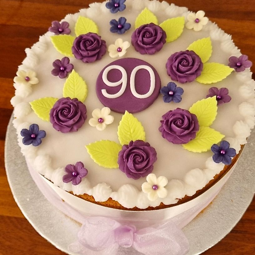 Customer's pretty cake using the cake decorations with a 90 plaque.