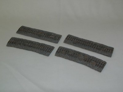 Battle-damaged railroad tracks. Four 6-inch straight sections, four 6-inch curved sections