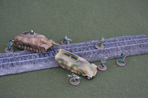 Straight railroad tracks with roadbed. Eight 6 inch sections