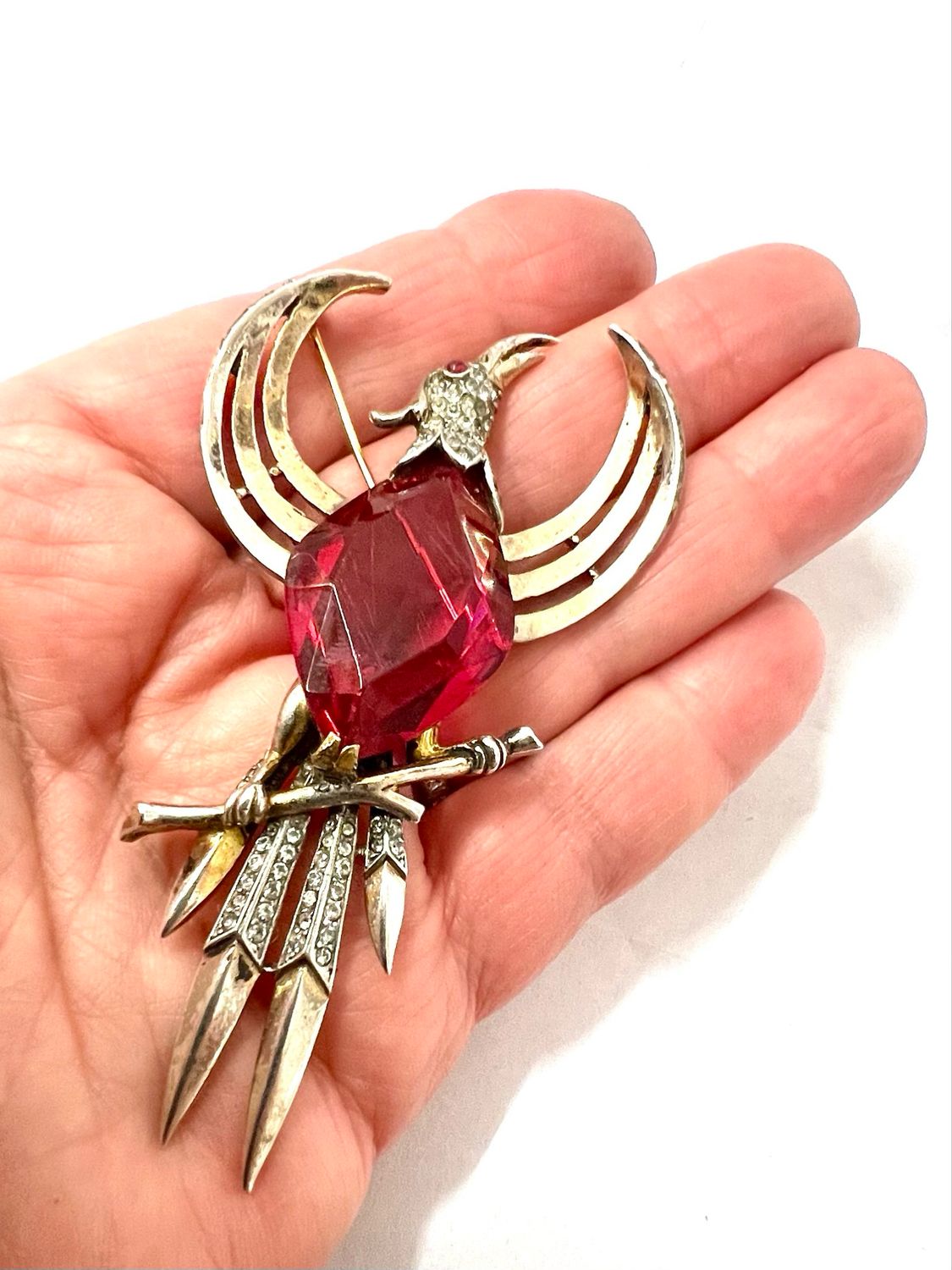 Large brooch signed “Trifari” sterling silver gold-plated, in the shape of a firebird set with rhinestones