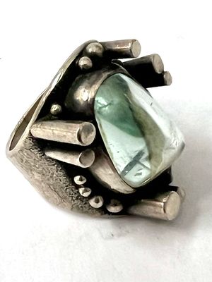 Original fantastic aquamarine ring midcentury around 1969 inspired by the moon landing design of the lunar surface, artist signature. The matching pendant is available