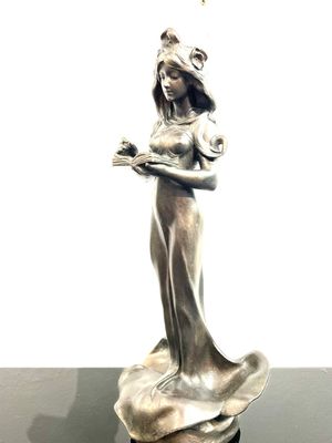 Art Nouveau sculpture of a reading very pretty woman melting into a pansy leaf signed Elias, France around 1900