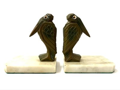 Pair of amusing Art Deco bookends in the shape of marabous made of bronzed metal with glass eyes, signed H. Moreau, France, around 1930