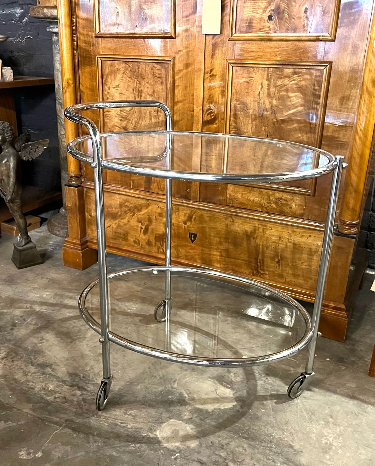 An original English tea trolley, bar trolley, serving trolley was made around 1930 in chrome and glass with clean lines and simple elegance, this bar trolley has three wheels .
