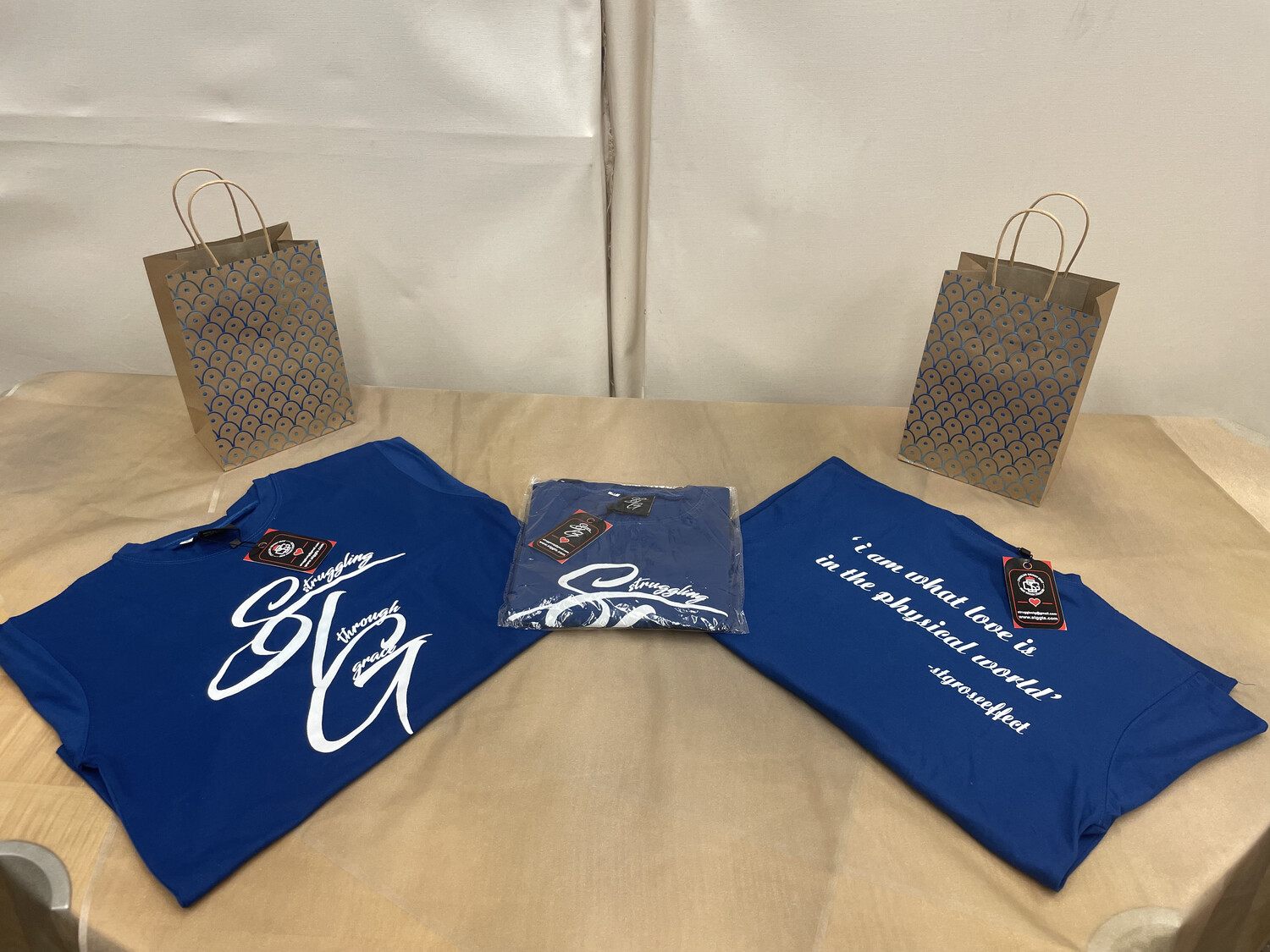 STG Cursive (Blue with white lettering)