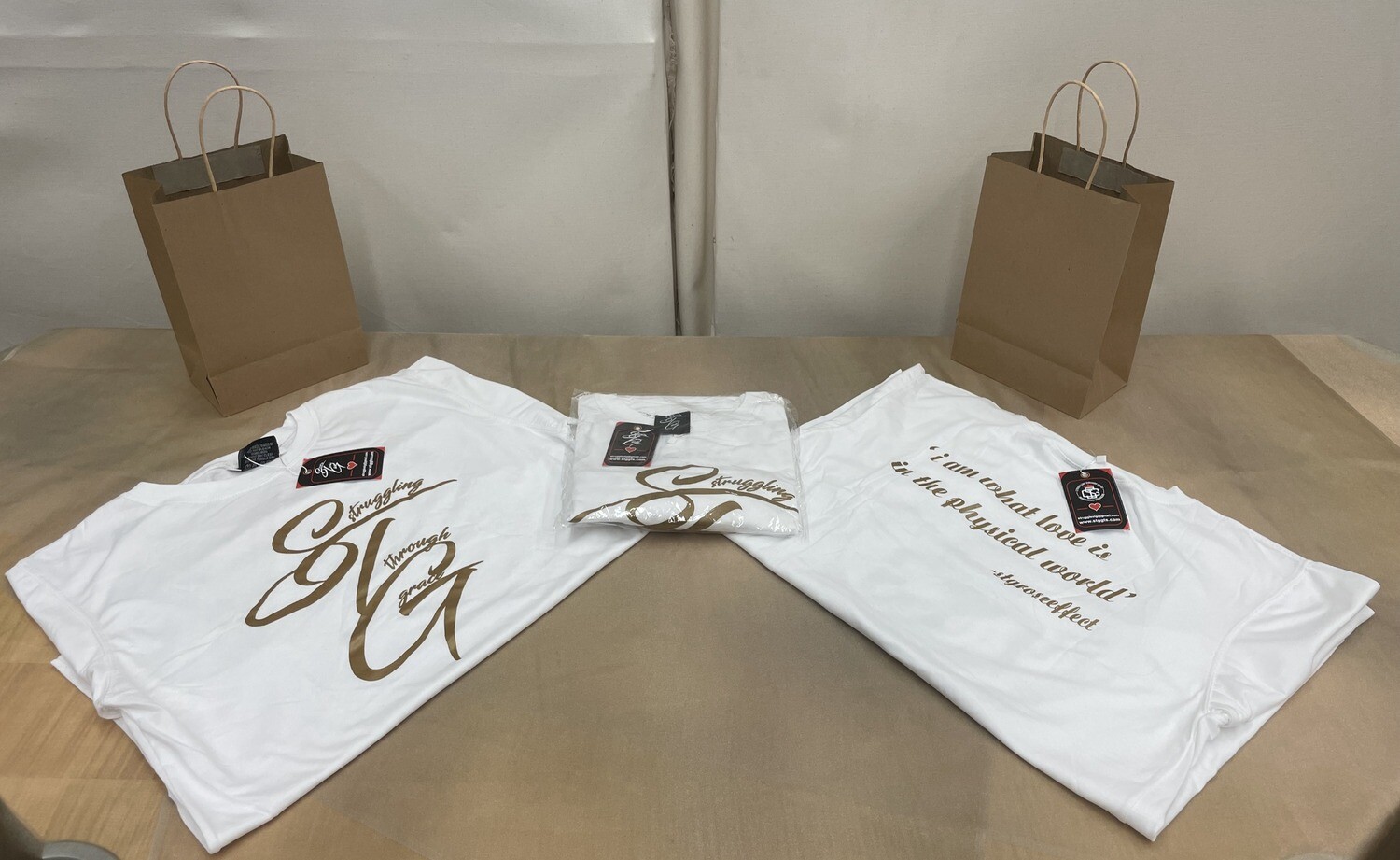 STG Cursive (white with gold lettering)