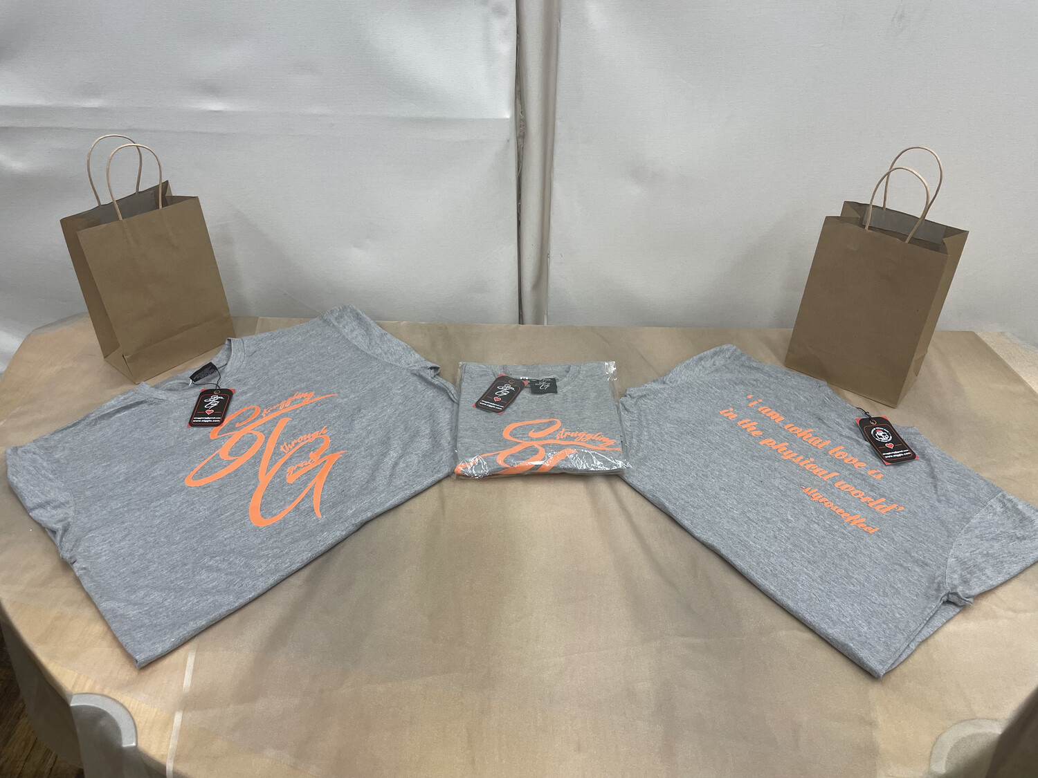 STG Cursive (Grey with orange lettering)