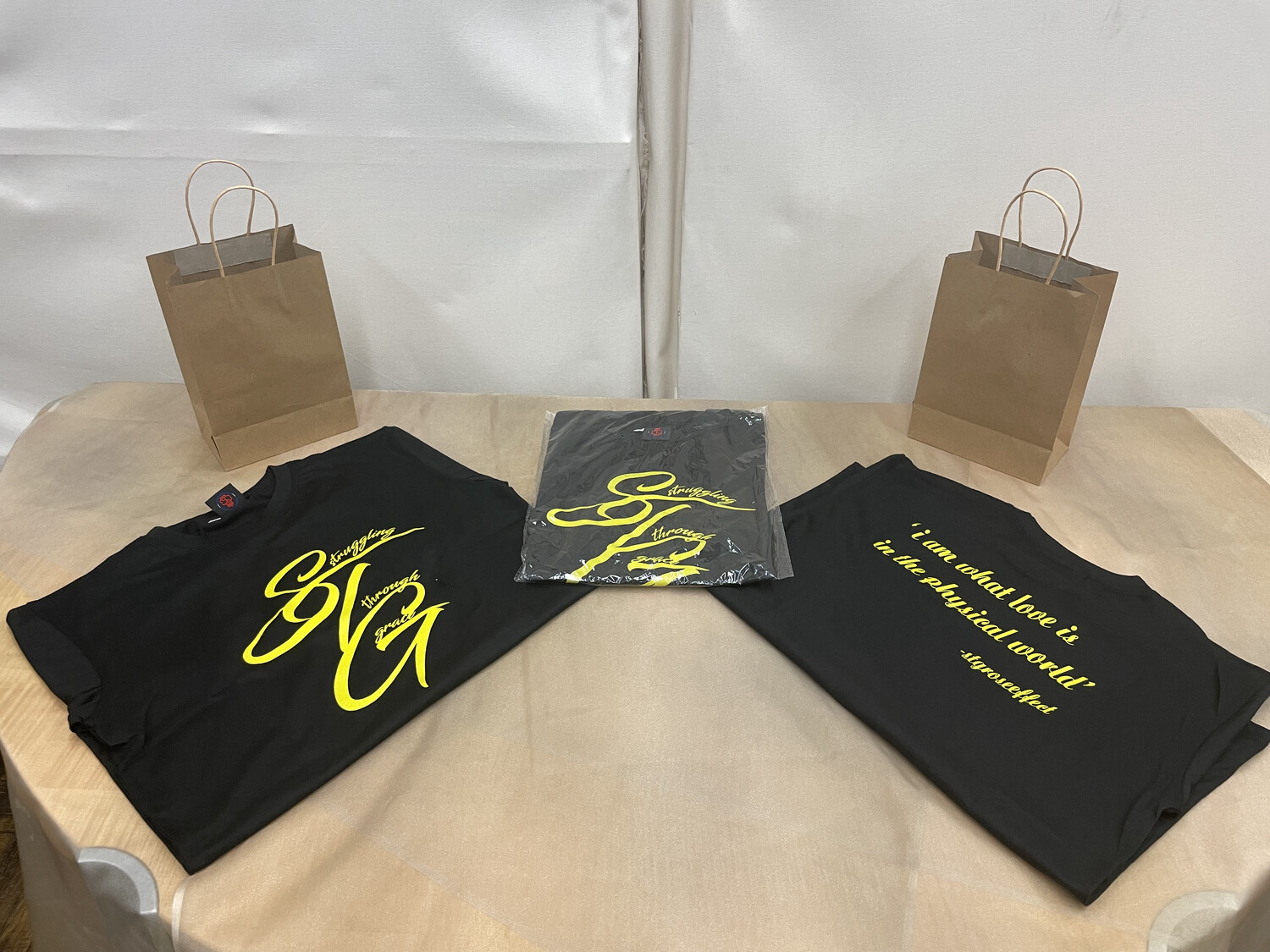 STG Cursive (black with yellow lettering)