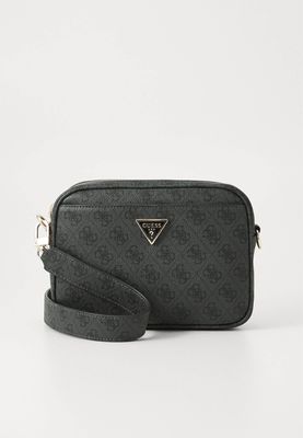 GUESS Tracollina Meridian Coal Logo