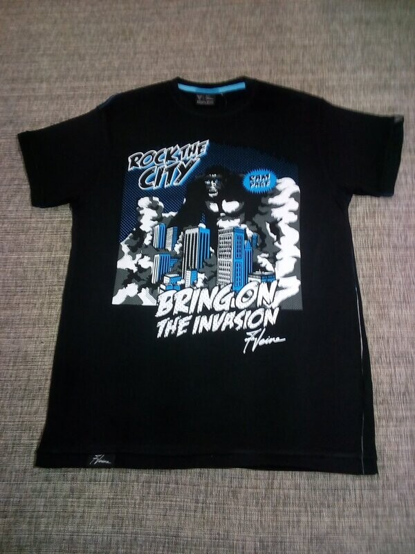 T-Shirt - 48/50 - La Ville de New York est Envahie par un Gigantesque Gorille T-Shirt - 48/50 - La Ville de New York est Envahie par un Gigantesque Gorille "King Kong" Son Passage terrifie cette Ville "Rock The City" soit "Bring on The invasion".
