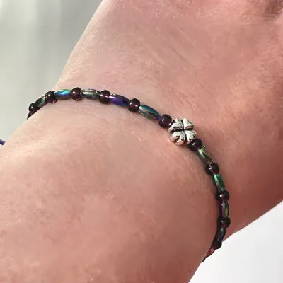 Buy a thin titanium colored clover leaf bracelet