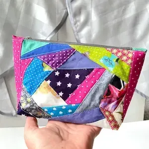 Rectangular cotton cosmetic bag in patchwork style in bright, cool colors, padded with zipper