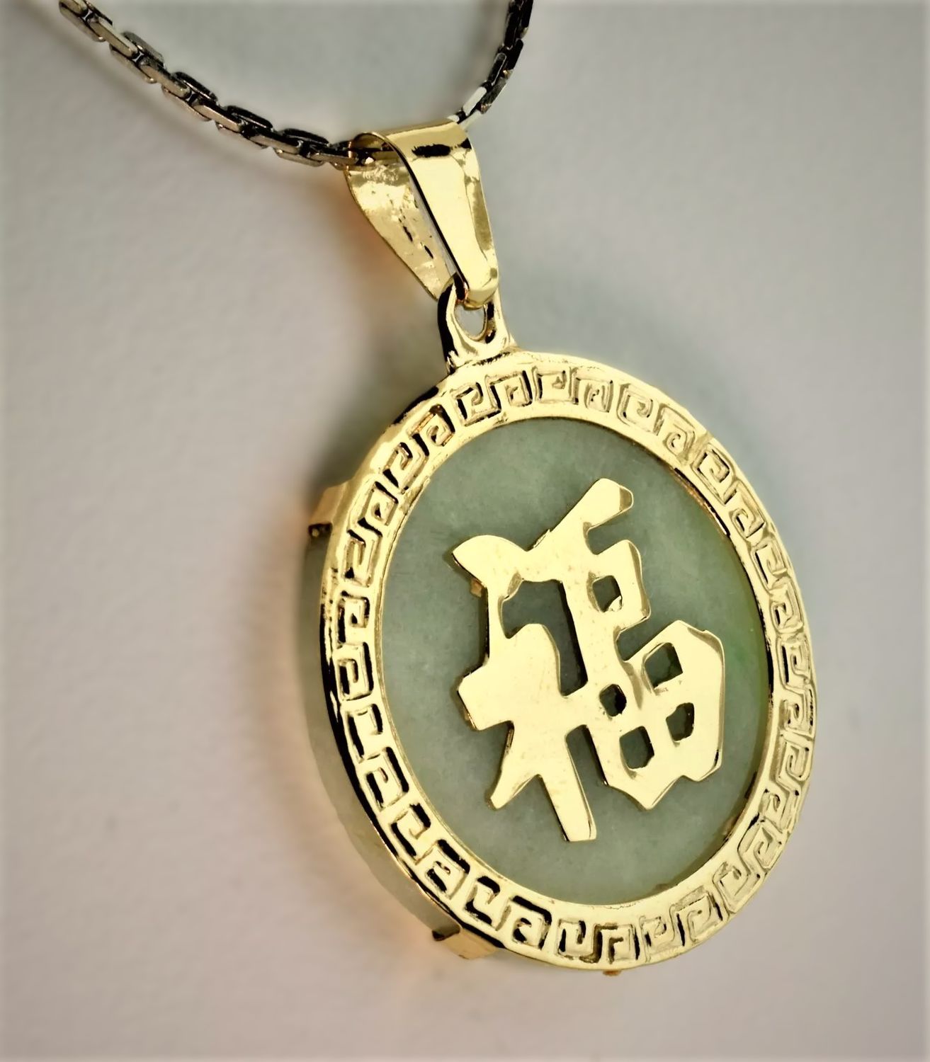 Jade and 14K yellow gold penant