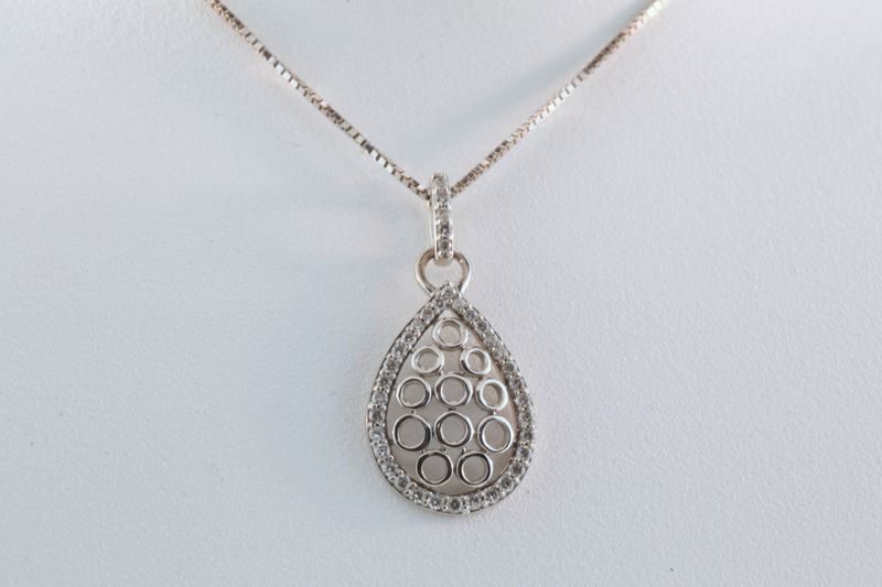 Pear Shaped Pendant set with Diamonds