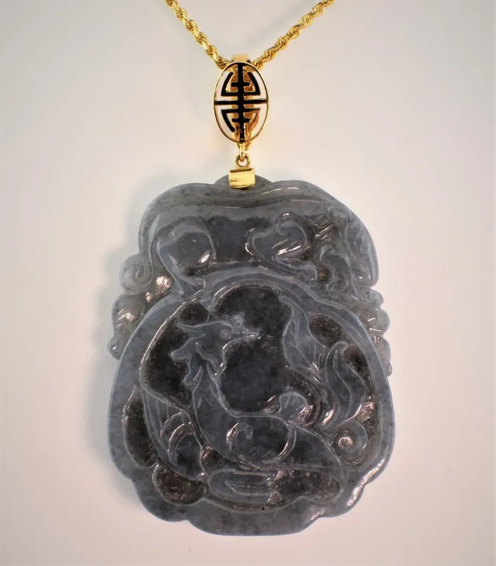 Gray Jade Depicting a dragon with a tiger crouched on top